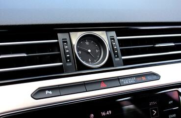Clock Inside the Centre Console Interior. Car interior details of chronometer analog clock,...