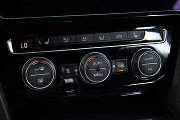 Air conditioner with power regulator. Car climate control. Automotive climate control. Modern Car air conditioner, interior of a new modern car.
