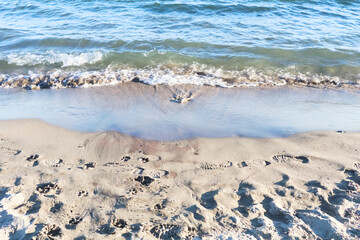 Calm waves hitting the sea shore