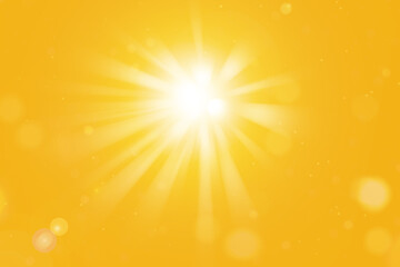 Bright sun with sun rays and lens flares on orange summer background. Sunny summer wallpaper.