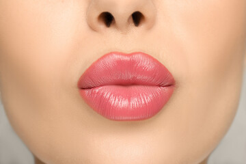 Closeup view of woman with glossy lipstick
