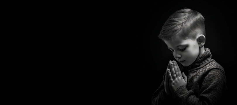 Black and white studio portrait of a young child praying banner on black background. Generative AI illustration