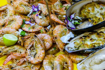 Prepared shrimps and oysters on the plate