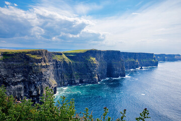 Fototapeta premium Spectacular Cliffs of Moher are sea cliffs located at the southwestern edge of the Burren region in County Clare, Ireland. Wild Atlantic way