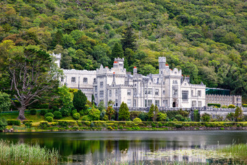Kylemore Abbey with water reflections in Connemara, County Galway, Ireland, Europe. Benedictine...