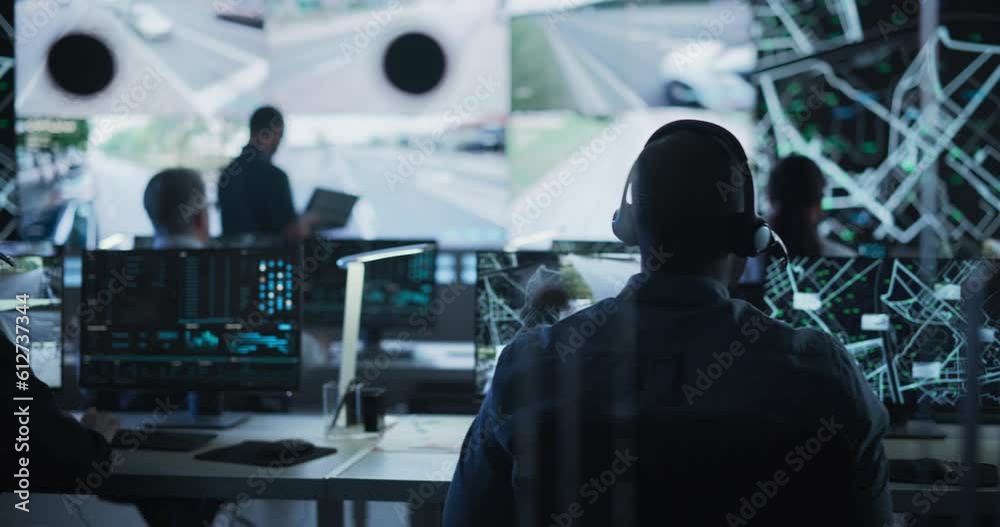 Poster Diverse Team of Specialists Analyze Surveillance Feeds, Monitor Targets on a GPS City Map, Ensure Efficient Traffic Operations. Intensive Work in a Monitoring Room with Big Data Analytics Engineers