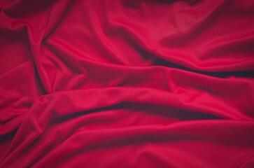 Wrinkled fabric texture. Close-up of soft cotton cloth, may be used as background. - 612737526