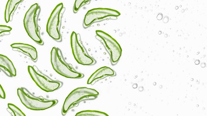 Obraz premium Thinly sliced slices of green fresh Aloe Vera. Background of the Aloe. Lots of slices of Aloe