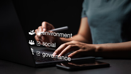 Concepts of ESG, environment, society and governance. Energy of a sustainable natural gas business Businessman using computer to analyze investment concept Business strategy for society, environment