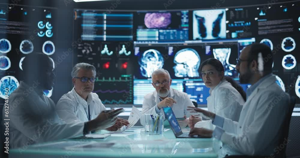 Poster chief doctor conducting a pre-operative assessment meeting with his surgical team. group of brain su