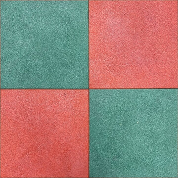Colorful rubber tile on playground floor at the yard in the park. Children's playground in the park with soft floors.