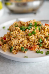Fried rice with scrambled eggs and vegetables. Cooked with whole grain or brown rice.