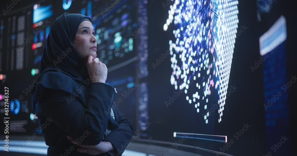 Poster Portrait of a Smart Focused Middle Eastern Software Engineer Analyzing Neural Network Big Data on a Digital Screen. Young Arab Woman in Hijab Working in an Innovative Internet Service Company