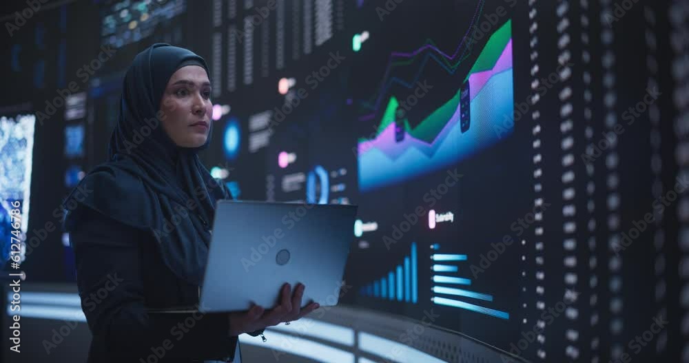 Leinwandbilder muslim female data center it engineer standing in a room with an ai neural network settings on a dig