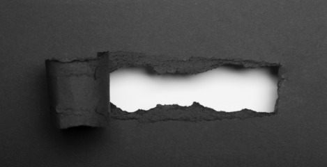 realistic black torn paper with rolled edge on transparent background - frame for text or design