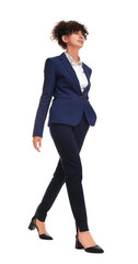 Beautiful businesswoman in suit walking on white background