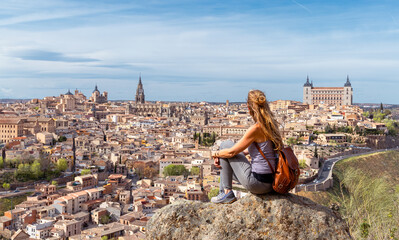 Fototapeta premium Woman traveling in Spain- Panoramic view of Toledo city