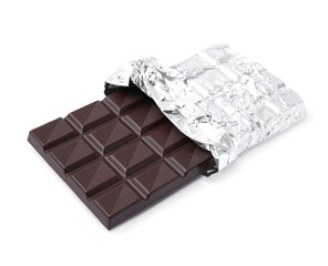 Delicious dark chocolate bar wrapped in foil isolated on white