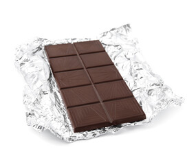 Delicious dark chocolate bar with foil isolated on white