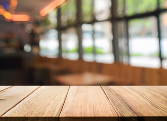 Wooden board empty table in front of blurred background. Perspective brown wood over blur in coffee shop - can be used for display or montage your products. Mock up for display of product.