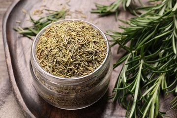 Dry and fresh rosemary on board, closeup