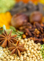 Various spices, peppers and herbs close-up top view. Eastern spice market. A set of peppers and spices for cooking.