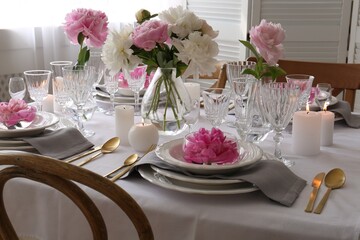 Stylish table setting with beautiful peonies in dining room