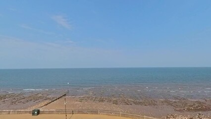  Hunstanton, Norfolk, UK – June 11 2023.  Panning shot over Hunstanton beach on the North Norfolk coast. Captured from the lookout point on a bright and sunny morning
