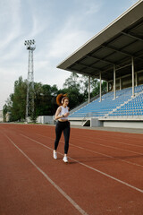 woman running in the stadium