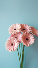 A vase filled with pink gerbera flowers against a blue wall. Generative AI. - obrazy, fototapety, plakaty