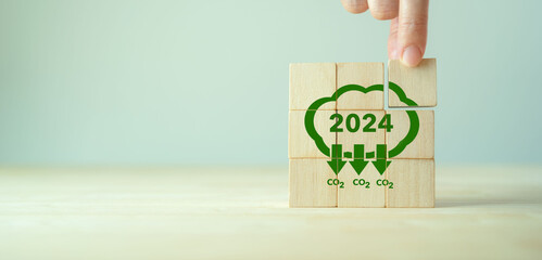 Reducing carbon emissions target in 2024. Green business, enviromental sustainability. Climate...