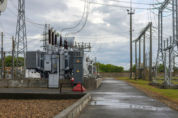 Power transformer at high voltage distribution station in modern electrical substation