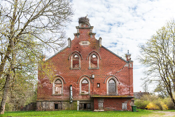 Fototapeta premium Abandoned red brick Regi manor, Latvia.