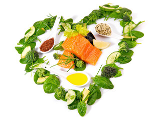 Heart Shape green Salad and Vegetables with Raw Salmon isolated on white Background