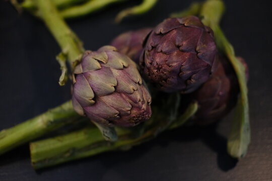 A close-up of some purple artichokes.
