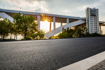 Asphalt road and bridge architecture at sunset