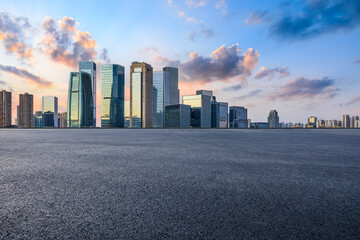 Asphalt road and urban skyline with modern buildings scenery