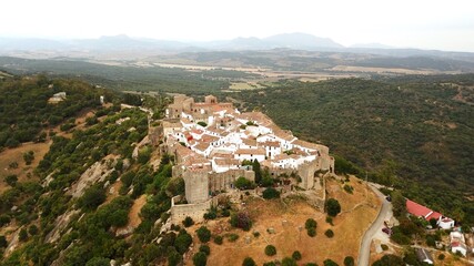 Fototapeta na wymiar aerial view of Castillo de Castellar, medieval town within a castle in Andalusia at a cloudy day, Castellar de la Frontera, province of Cádiz, Spain