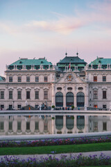 Fototapeta na wymiar Belvedere palace in Vienna at pink sunset and beautiful clouds