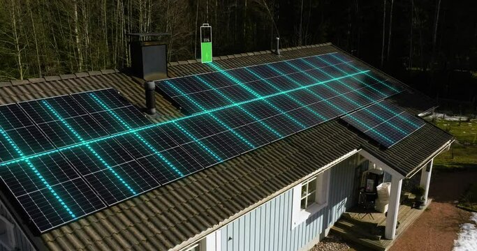Future home loading batteries full of energy through solar cells, sunny, winter day