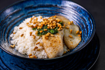 white cod with homemade basil pesto and roasted pine kernels
