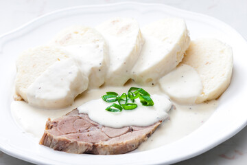 meat with cream sauce and dumplings