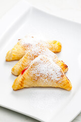 homemade puff pastry filled with strawberry jam