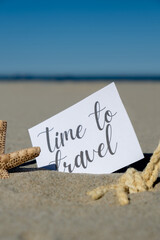 TIME TO TRAVEL text on paper greeting card on background of starfish seashell summer vacation decor. Sandy beach sun coast. Holiday concept postcard. Getting away Travel Business concept
