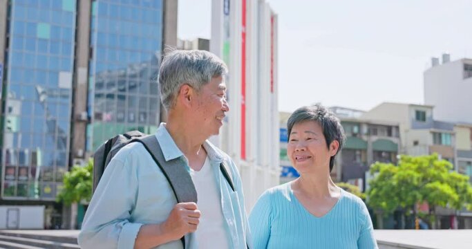 asian elderly couple walki together
