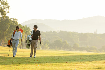 Group golf professional Golfer asian man walking in fairway with bag golf at golf  club.  Hobby in holiday and vacation with friends.  Lifestyle and Sport Concept