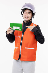Happy young Thai motorcycle taxi driver or rider pointing finger to Thai motor registration book isolated on white background. Financial and loan for worker concept.