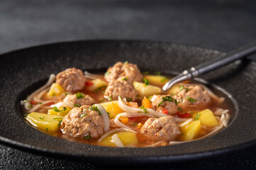 Meatballs soup, romanian traditional food. Ciorba de perisoare. 