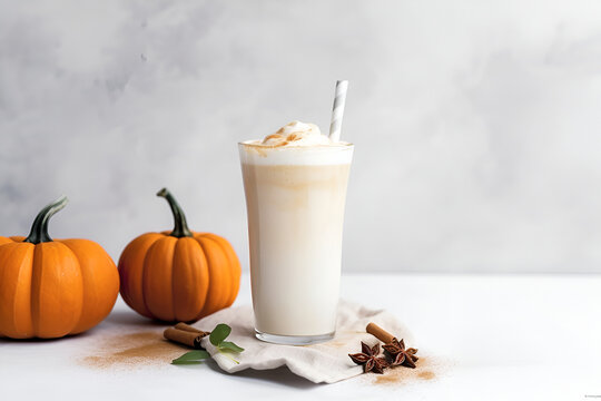 Glass of autumn pumpkin latte with whipped cream, cinnamon and drinking straw over light grey background. Coffee with pumpkin and spices on light background, copy space, high key. Generative AI