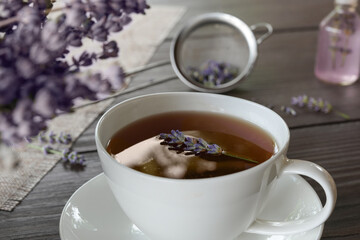 Fresh delicious tea with lavender and beautiful flowers. Side view.